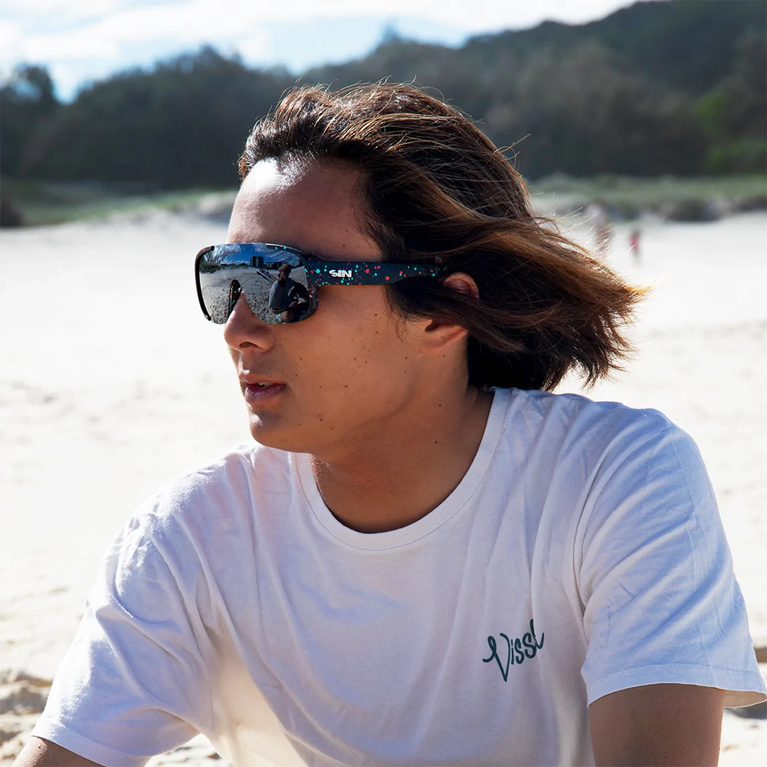 Rogue Polarised Black Shield Wrap Around Sunglasses on a male surfer