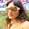 Rogue Polarised Gold Shield Wrap Around Sunglasses on a female model