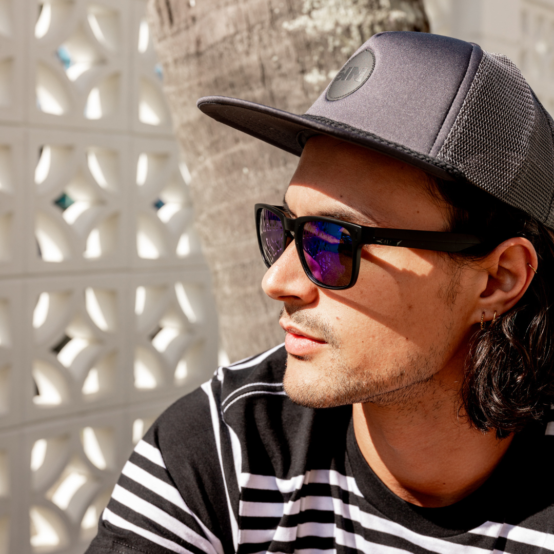 Rubber Badge Grey Cap side view on a male model