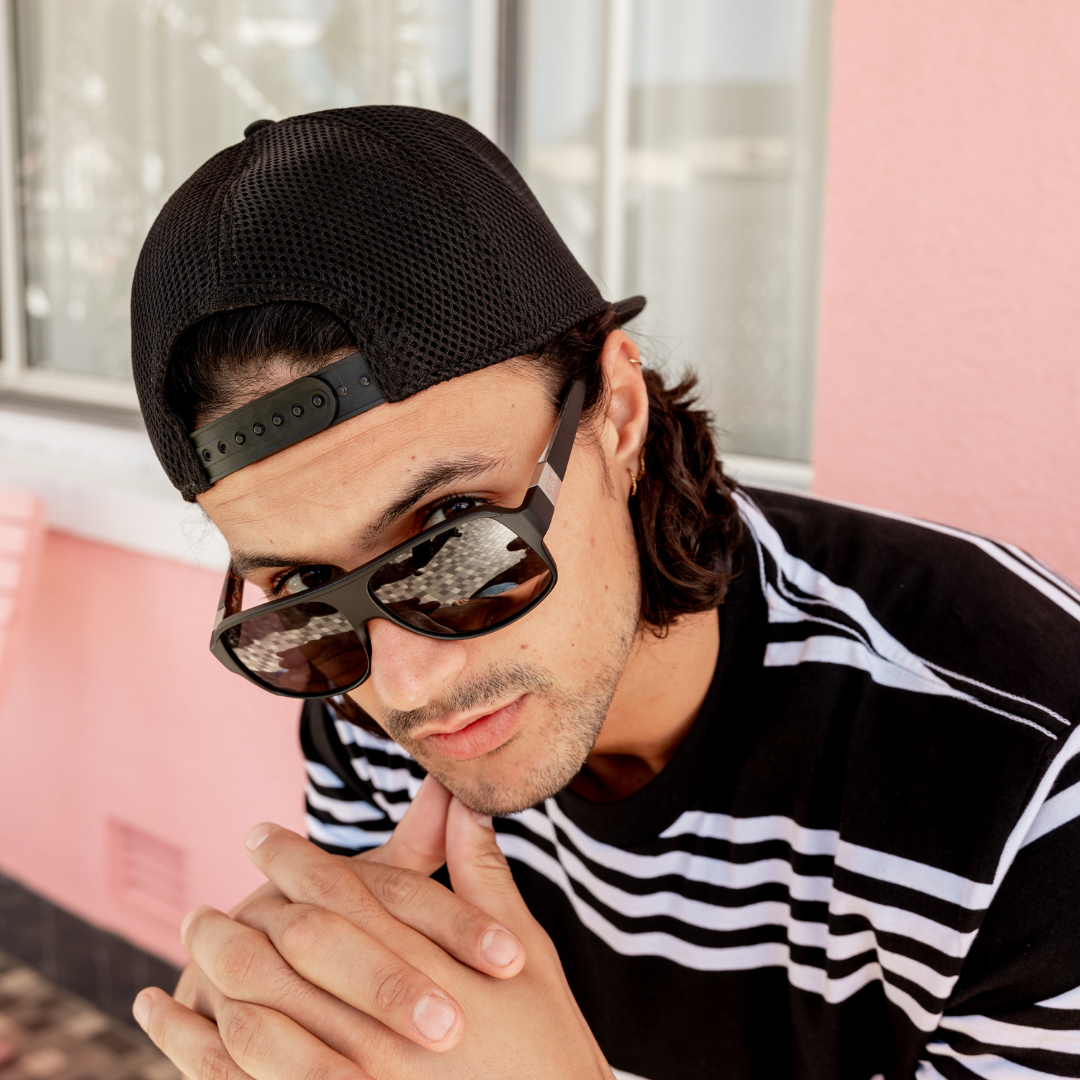 SIN Adjustable Black Cap on male model wearing cap backwards