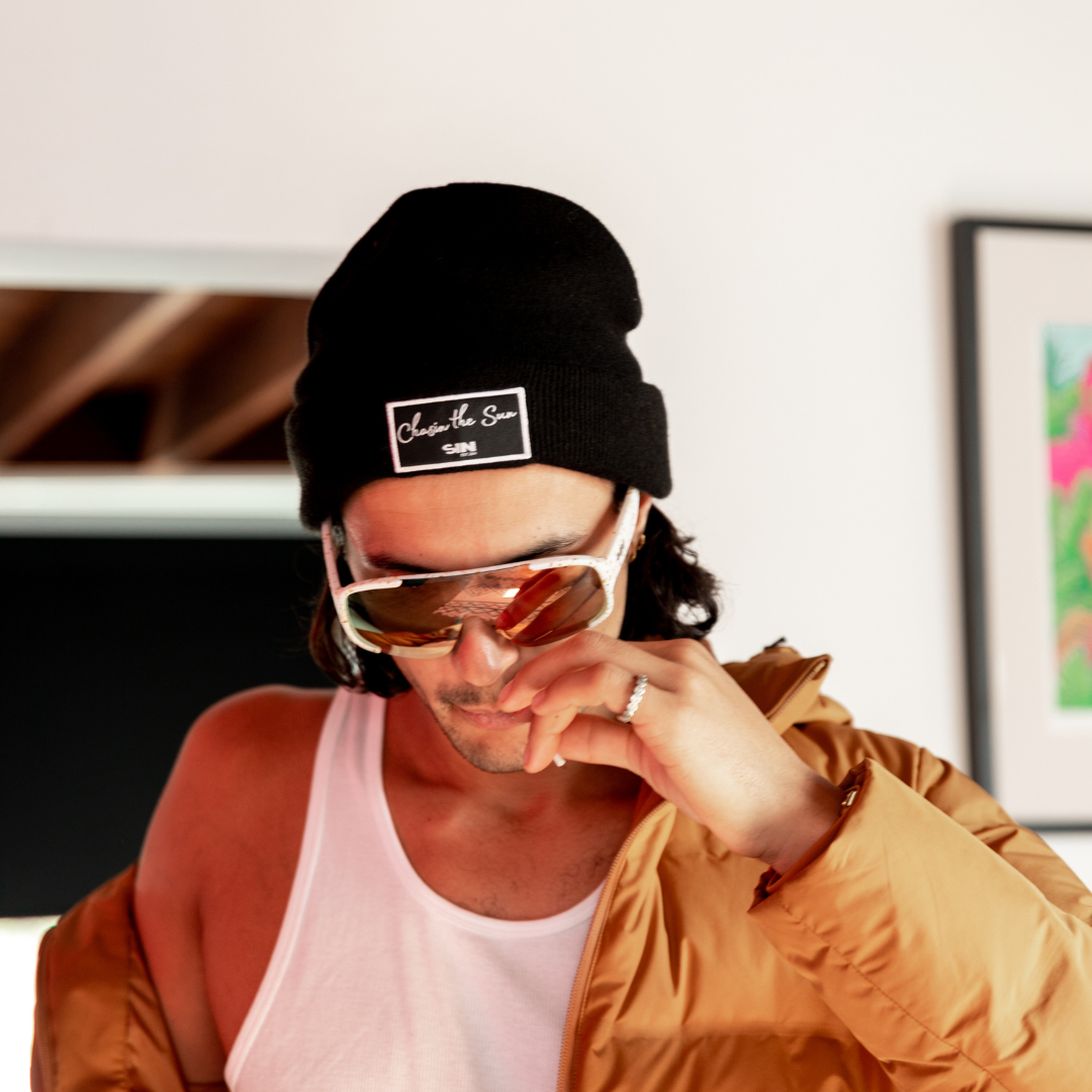 SIN Chasin the Sun Black Beanie on a male model looking down