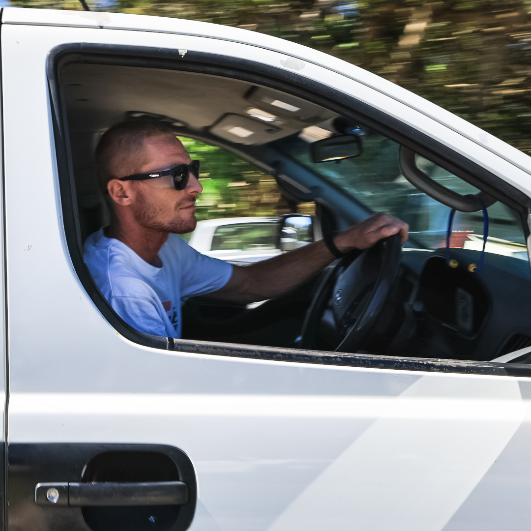 Safe & Sound Navy Wrap Around Safety Sunglasses Medium Impact Resistant on a Male Tradie driving