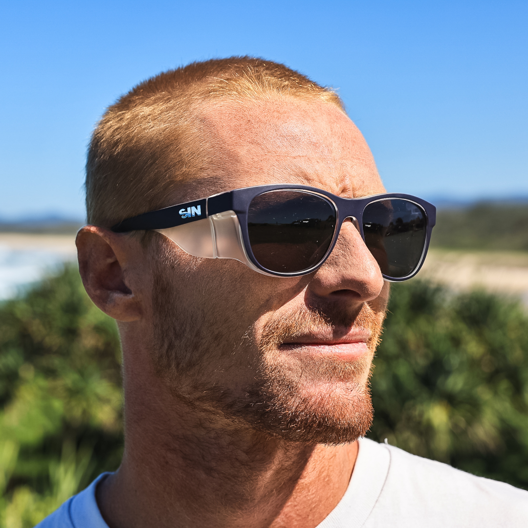 Safe & Sound Navy Wrap Around Safety Sunglasses Medium Impact Resistant side view on a Male Tradie
